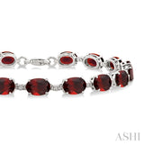 7X5 MM Oval Shape Garnet and 1/10 Ctw Round Cut Diamond Semi-Precious Bracelet in Sterling Silver