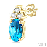 1/20 Ctw Oval Cut 5X3 MM Blue Topaz and Round Cut Diamond semi-precious Earrings in 10K Yellow Gold