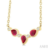 4X3MM Pear Cut Ruby and 1/50 Ctw Bezel Set Round Cut Diamond Precious Fashion Necklace in 10K Yellow Gold